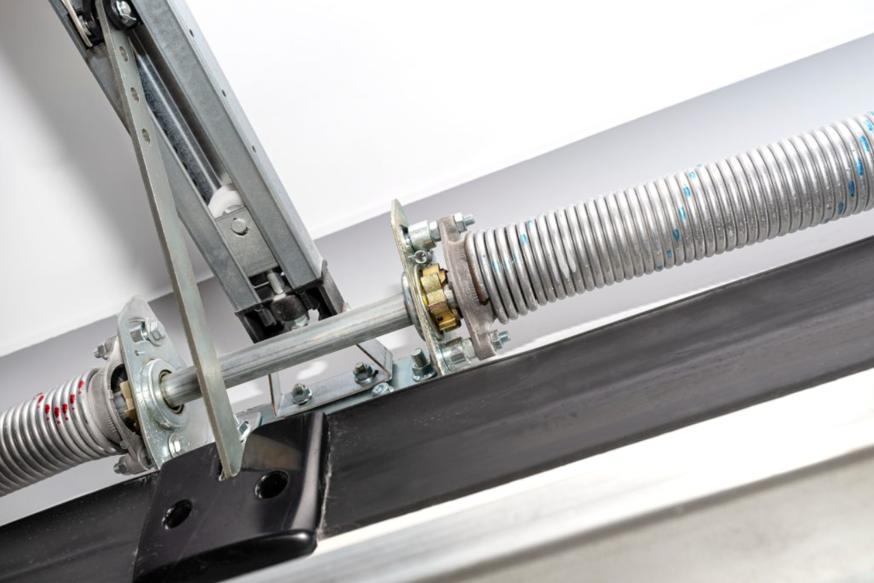 Close-up view of a technician performing garage door spring repair in Columbus, Ohio, highlighting expert repair services offered by our local garage door supplier.