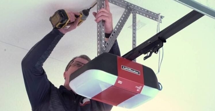 Professional garage door opener repair services in Columbus, Ohio, showcasing expert technicians fixing a garage door mechanism.